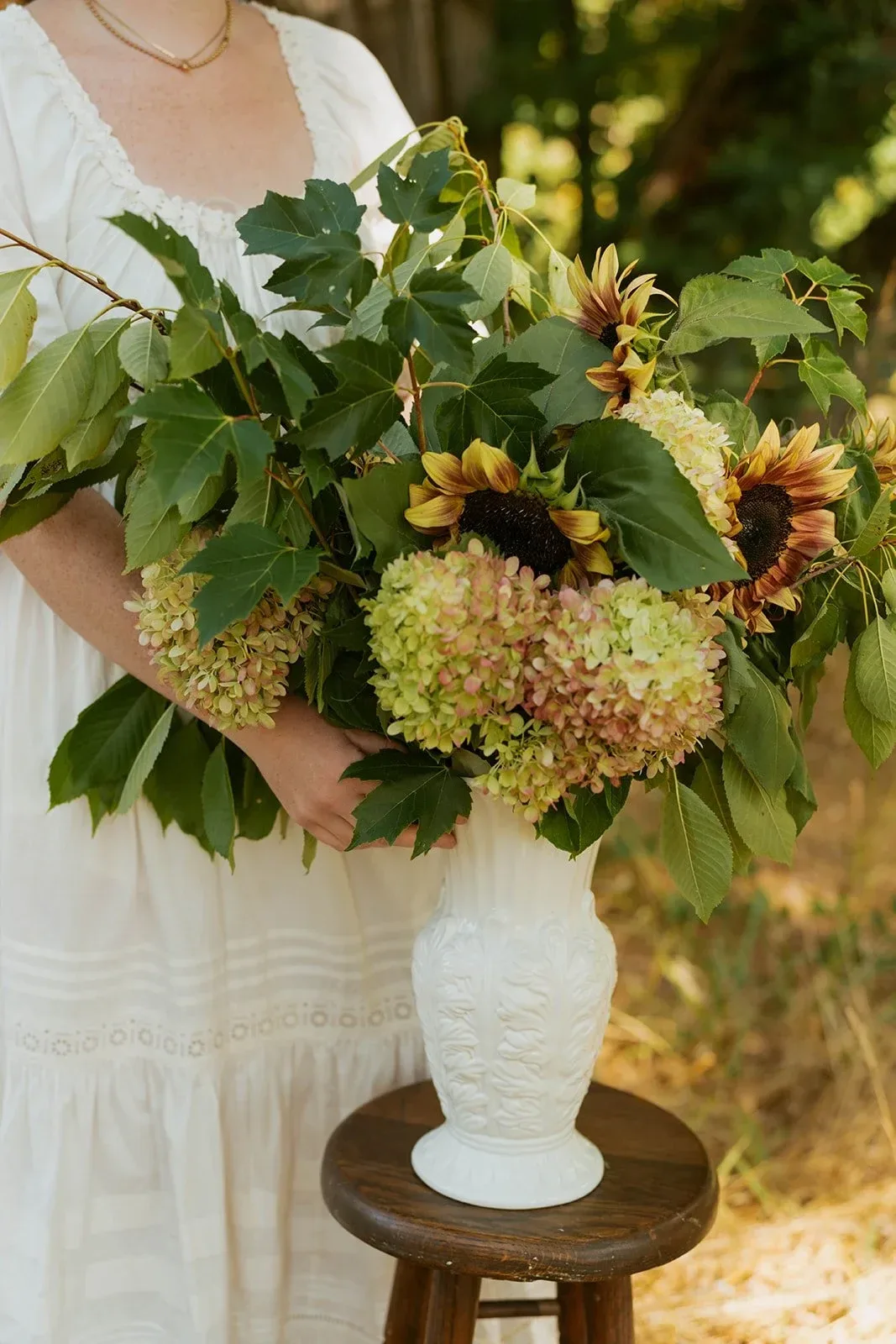 A sculptural, garden-inspired arrangement styled within an interior