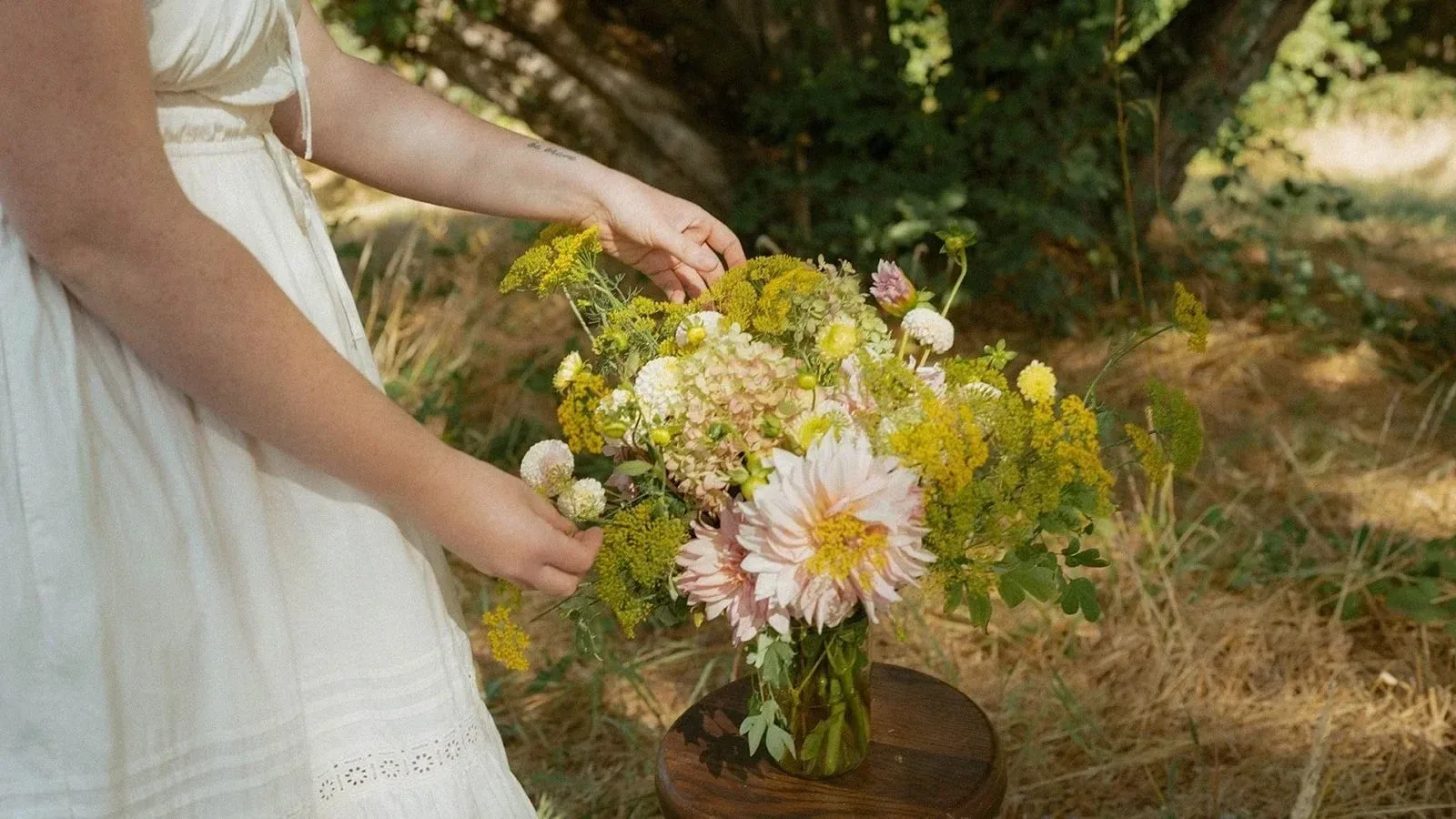 Seasonal blooms gathered on a worn wooden table